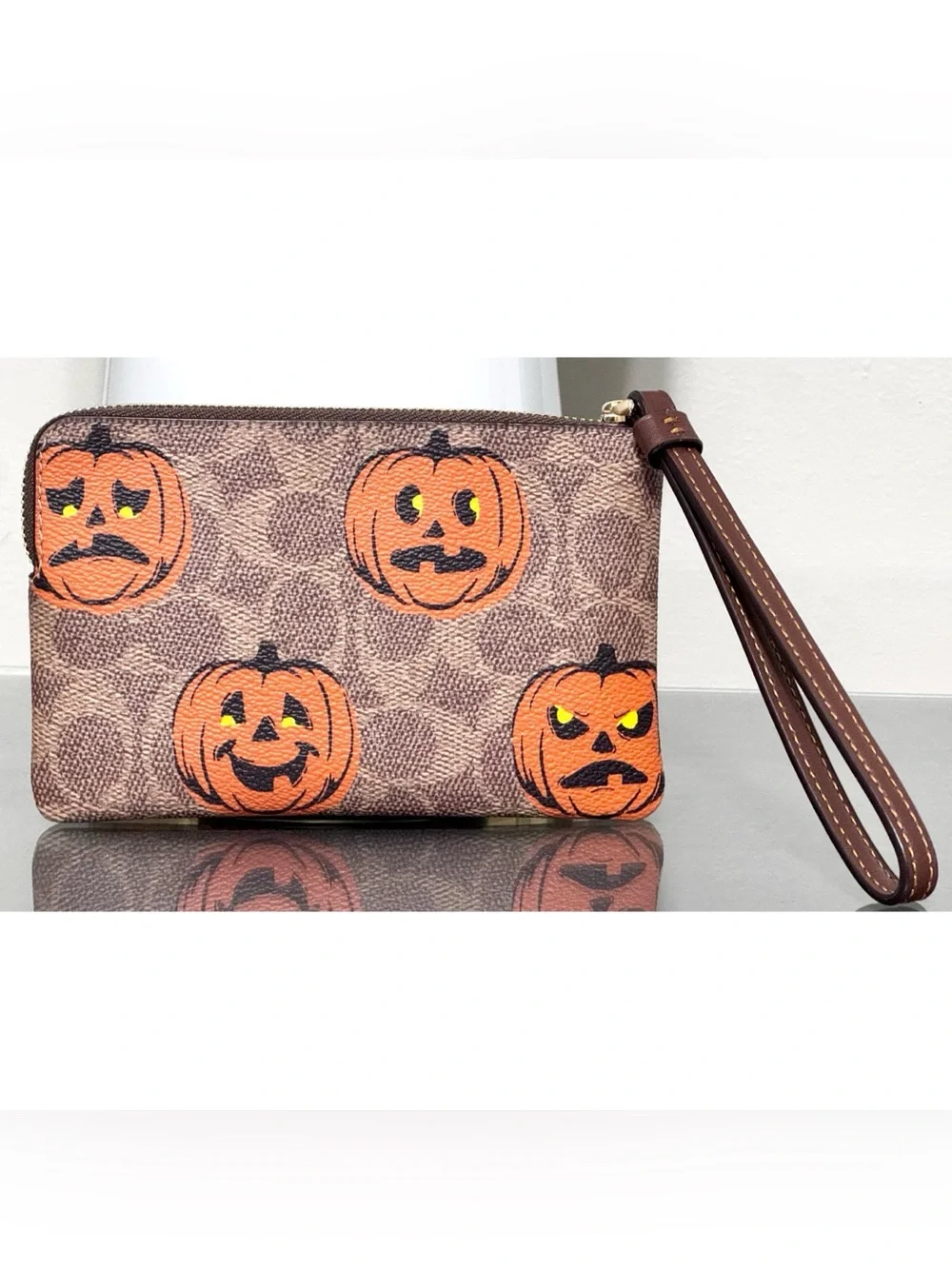COACH Corner Zip Wristlet In Signature Canvas With PUMPKIN HALLOWEEN PRINT